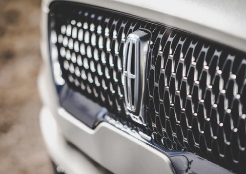 The grille of the 2024 Lincoln Aviator® Reserve model with an eye-catching repeated field of Lincoln Star logo shapes | Dave Sinclair Lincoln in St Louis MO