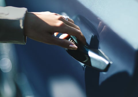 A hand gracefully grips the Light Touch Handle of a 2024 Lincoln Aviator® SUV to demonstrate its ease of use | Dave Sinclair Lincoln in St Louis MO