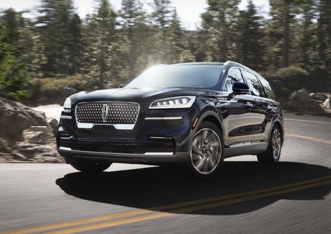 A Lincoln Aviator® SUV is being driven on a winding mountain road | Dave Sinclair Lincoln in St Louis MO